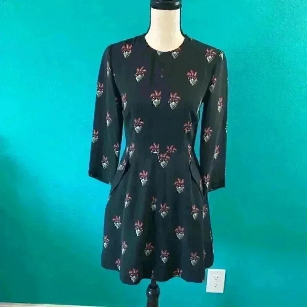 This is the “Terry” 3/4 sleeve silk mini dress by A.L.C in size 2